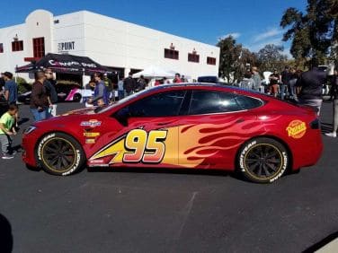Tesla Model 3 with Lightning McQueen livery at 2019 Drive Electric Earth Day Carlsbad.