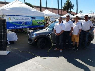 Green Energy EPC installation team and sales team pose in front of a first in U.S. arrival of BMW's Plug-In Hybrid Mini Countryman.