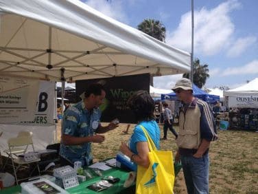 Action shots with Makello customers at EcoFest Encinitas, discovering LED lighting solutions.