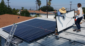 Research Intern Tatiana assisting on a solar installation